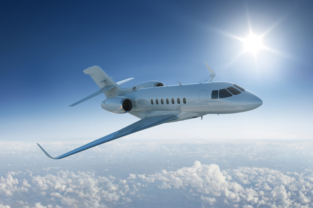 Commercial airplane cruising at high altitude during a sunny day, representing aviation operations.